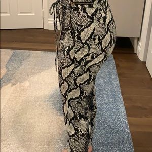 Snakeskin dress pants with gold zippers